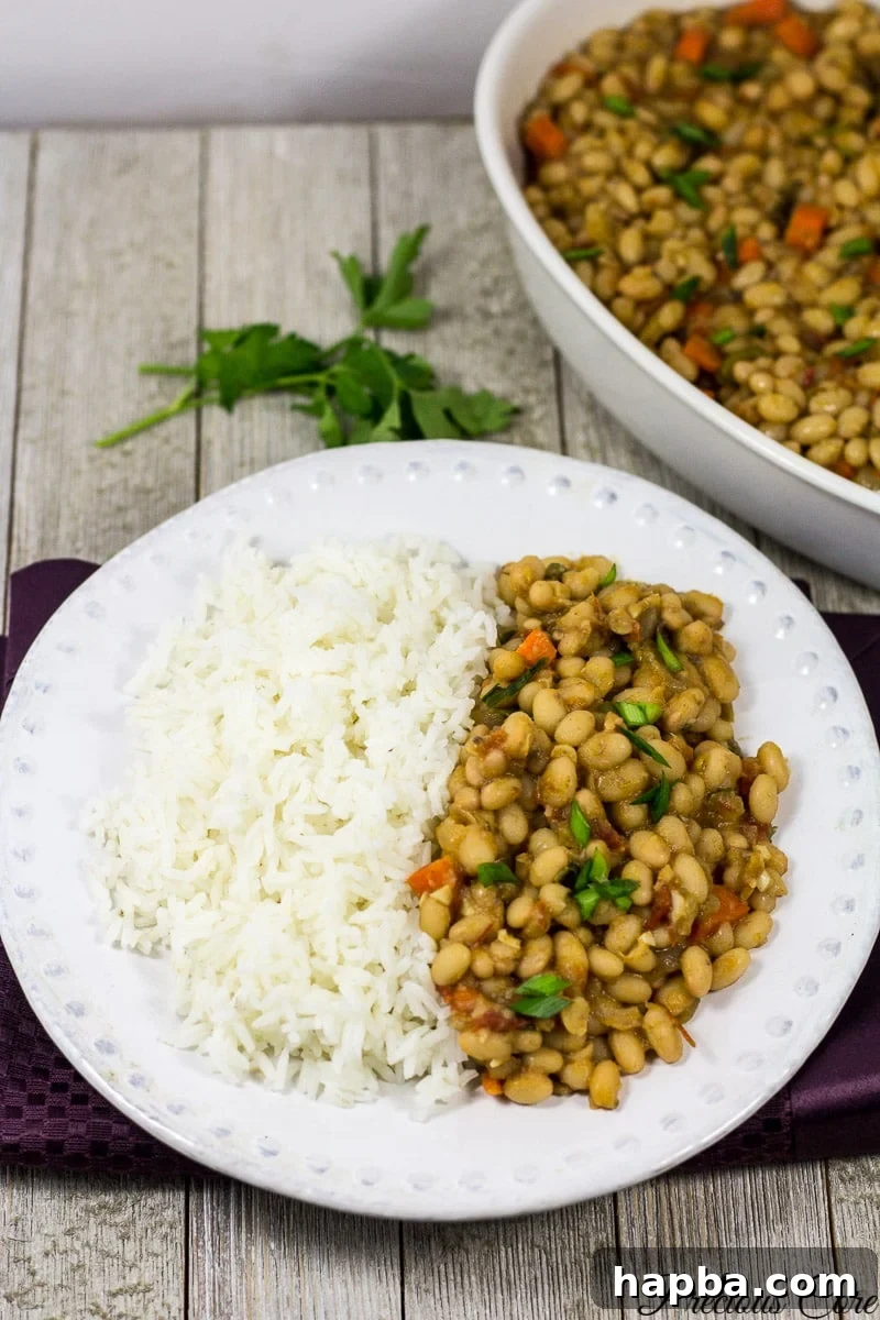 Wholesome White Bean Pot 6 White bean stew served with fluffy white rice, a complete meal.