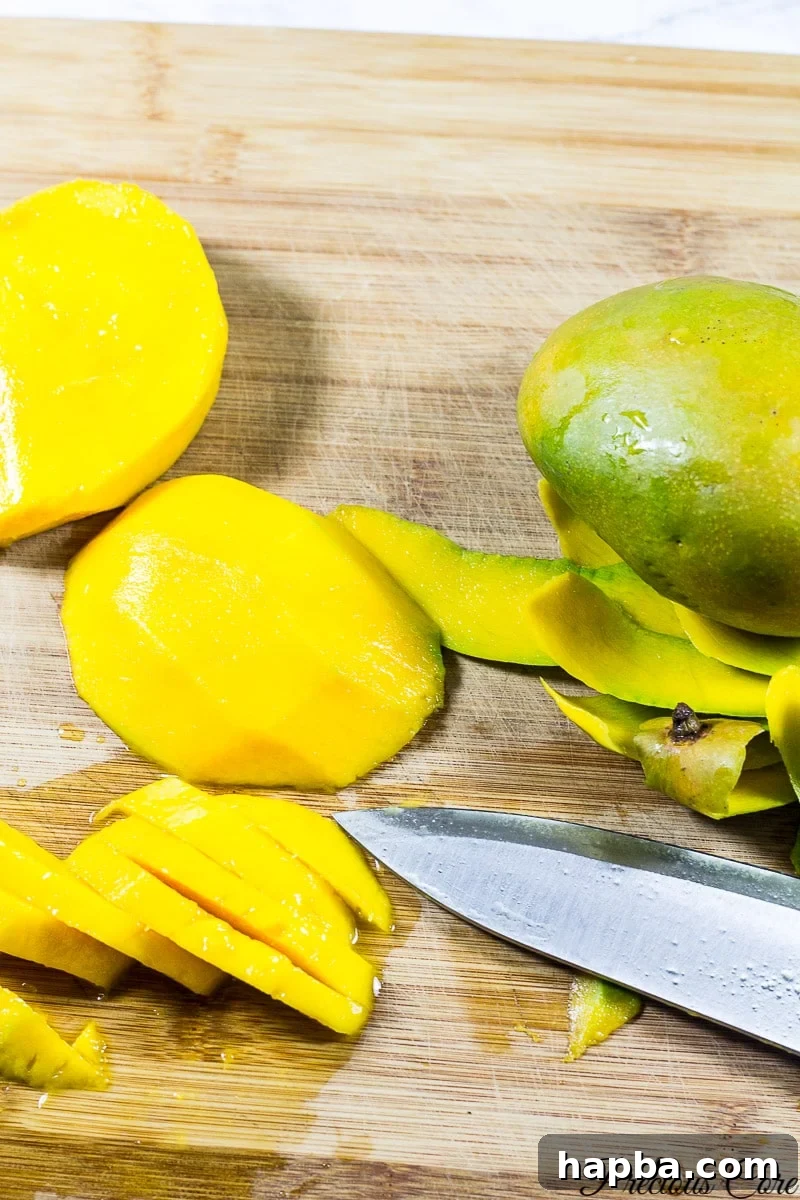 Tropical Mango Delight Cake 2 Half-inch thick slices of fresh, ripe mangoes arranged neatly