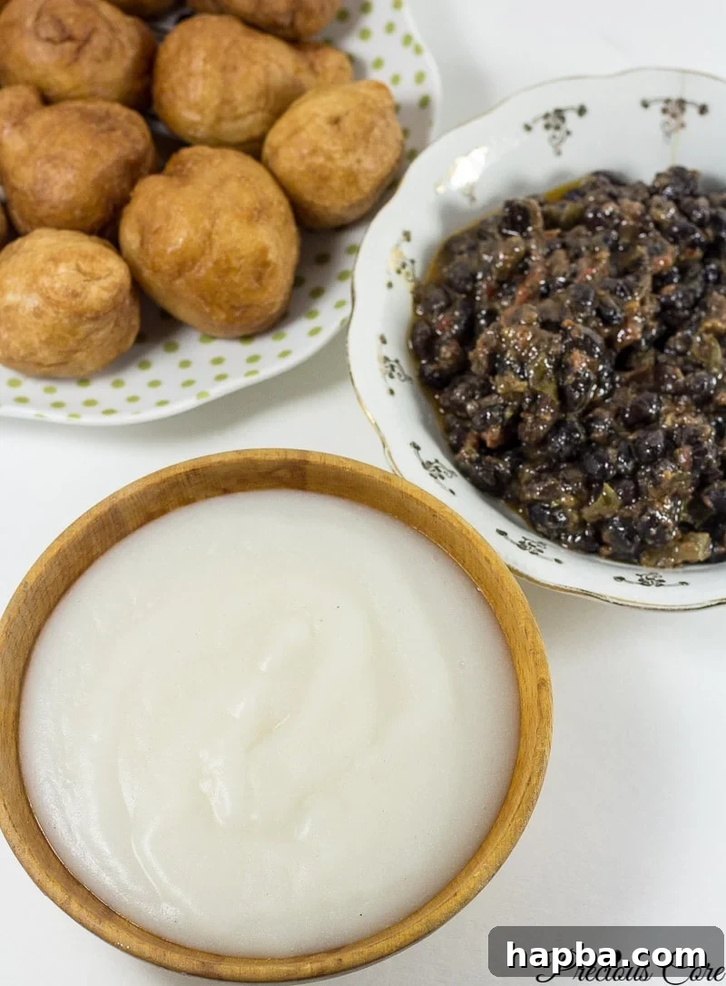 Freshly made Pap (fermented corn porridge) in a bowl, a traditional West African breakfast staple, highlighting its creamy texture.