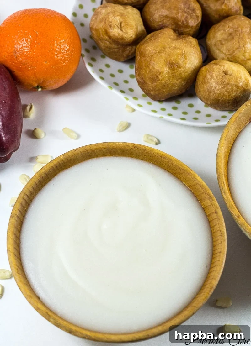 A beautifully presented bowl of hot, creamy pap, elegantly drizzled with evaporated milk, ready to be enjoyed as a comforting breakfast.