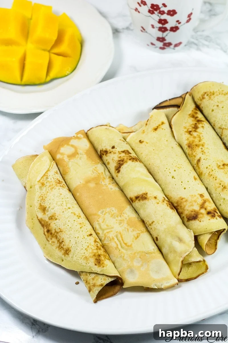Fluffy Cameroonian Bofrot 3 Large plate of rolled Cameroonian pancakes.