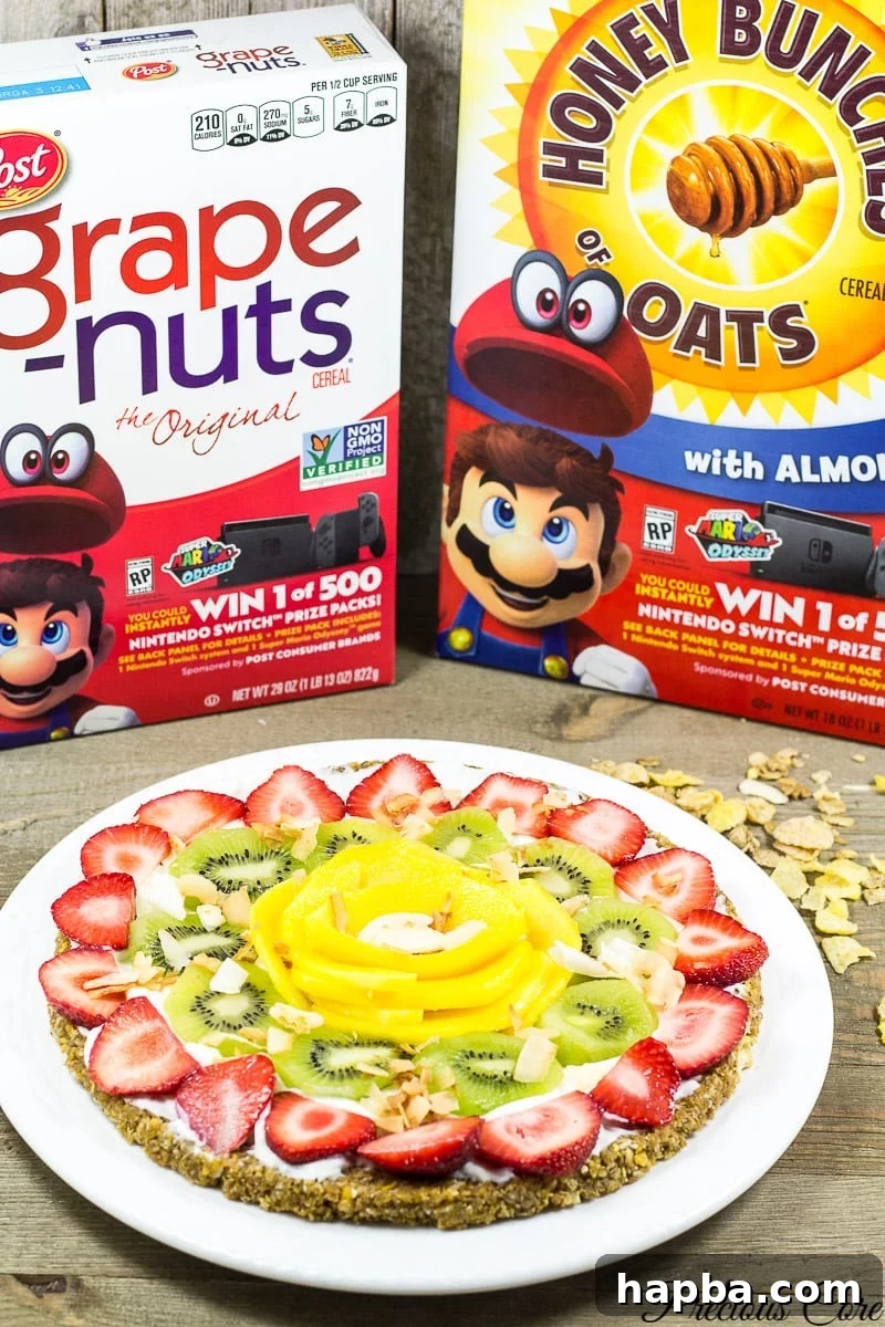 This breakfast pizza is made with a nutty cereal crust then topped with Greek yogurt and tropical fruits. It is simple, healthy and delicious!