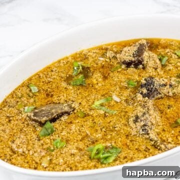 White, oblong bowl of Edusi stew.