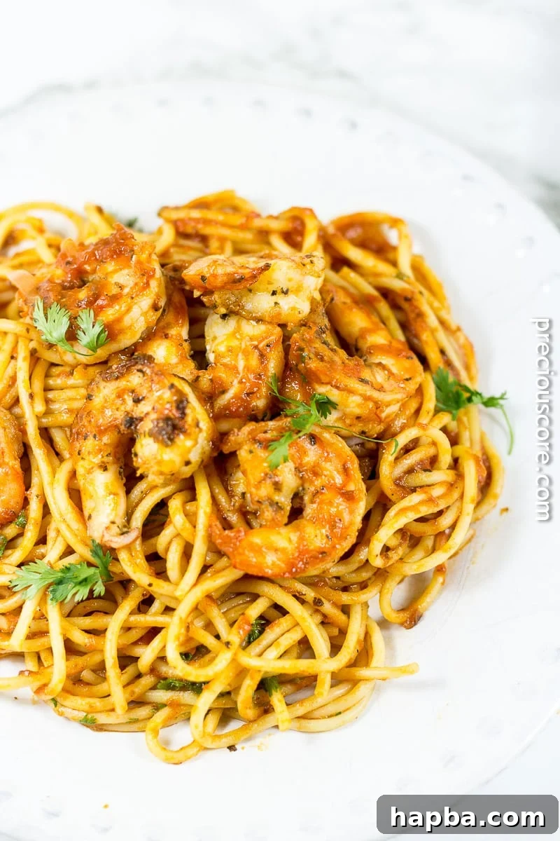 Close-up of Blackened Shrimp Pasta, showcasing perfectly cooked shrimp and rich tomato sauce.