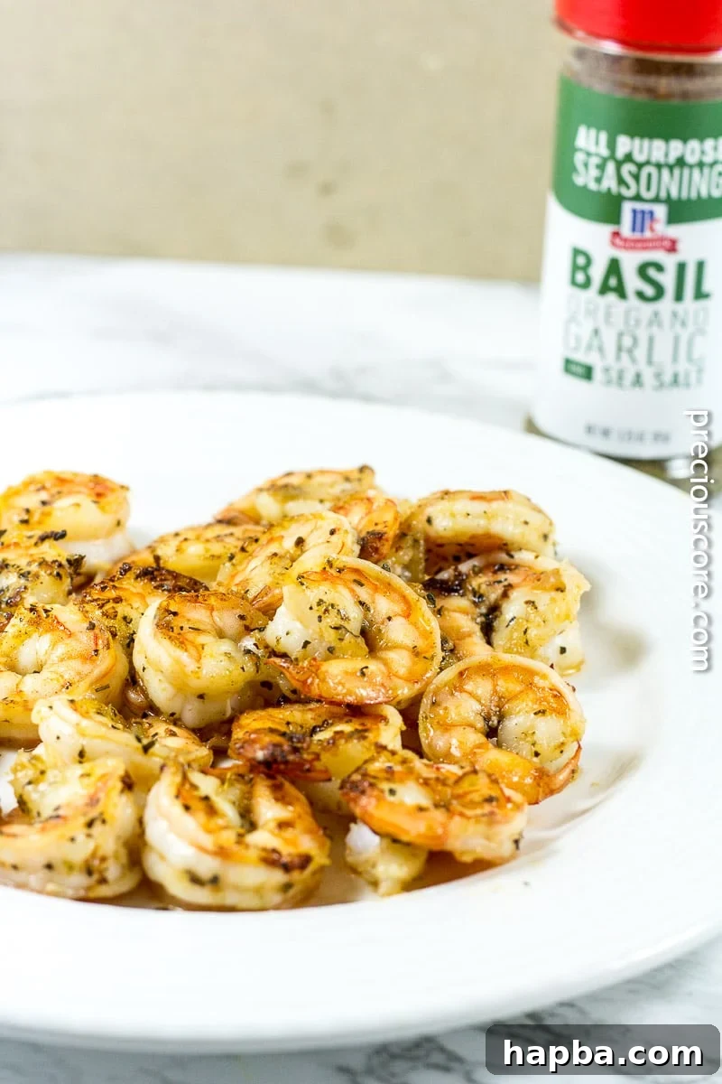 Pan-seared blackened shrimp, cooked to perfection, ready to be added to the pasta dish.