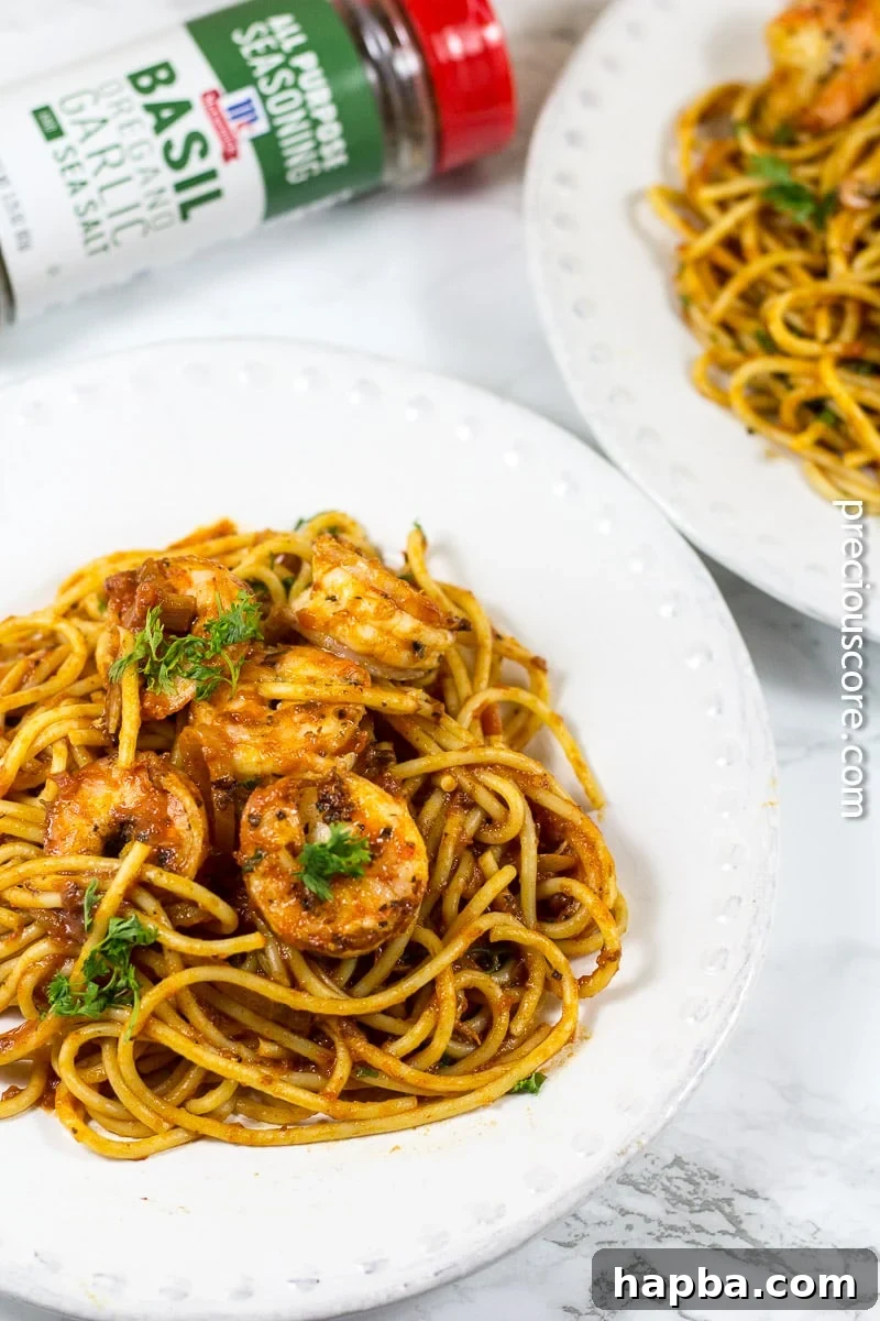 A serving of blackened shrimp pasta in a bowl, ready to enjoy, highlighting the ease of making this dish.
