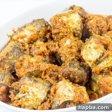 Sweet Heat Fish 7 Nigerian Peppered Fish recipe image, showing a circular dish of fish with the spicy sauce.