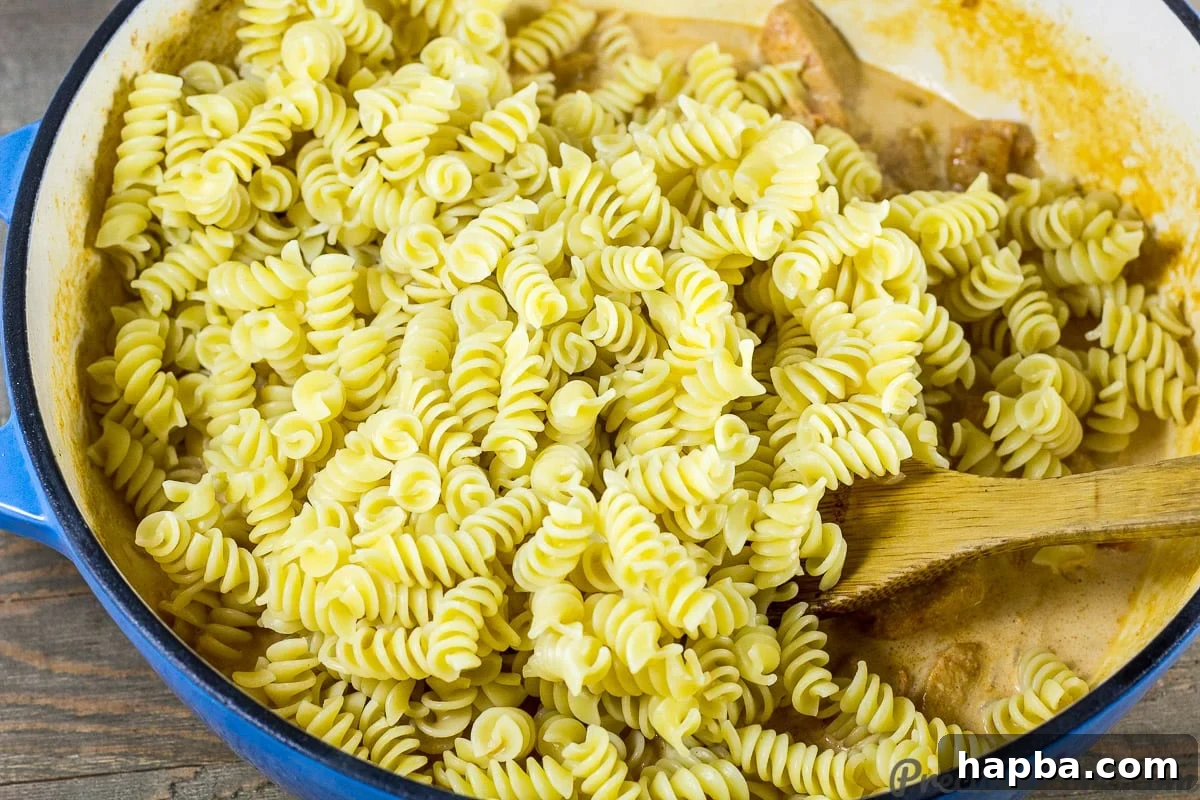 Add Cooked Macaroni to Creamy Chicken Sauce