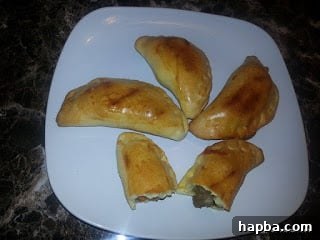 Golden brown African meat pies with a delicious filling