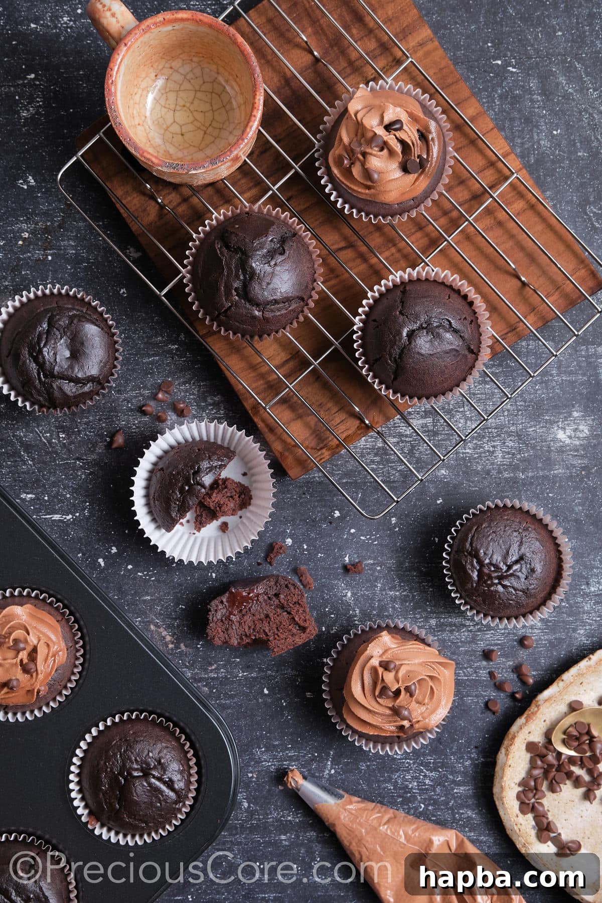 Frosting easy moist chocolate cupcakes with rich chocolate buttercream.