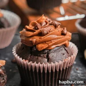 Zoom-in on a chocolate cupcake with chocolate frosting.