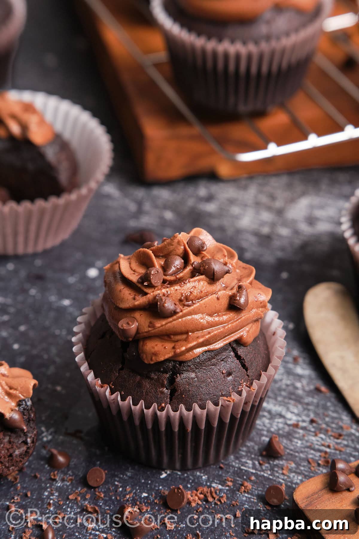 Wide shot showing the ingredients and tools for making easy chocolate cupcakes, ready for baking.