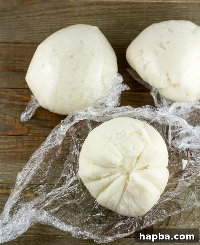 A single portion of Corn Fufu, unwrapped and ready to be eaten, demonstrating its firm yet pliable structure.