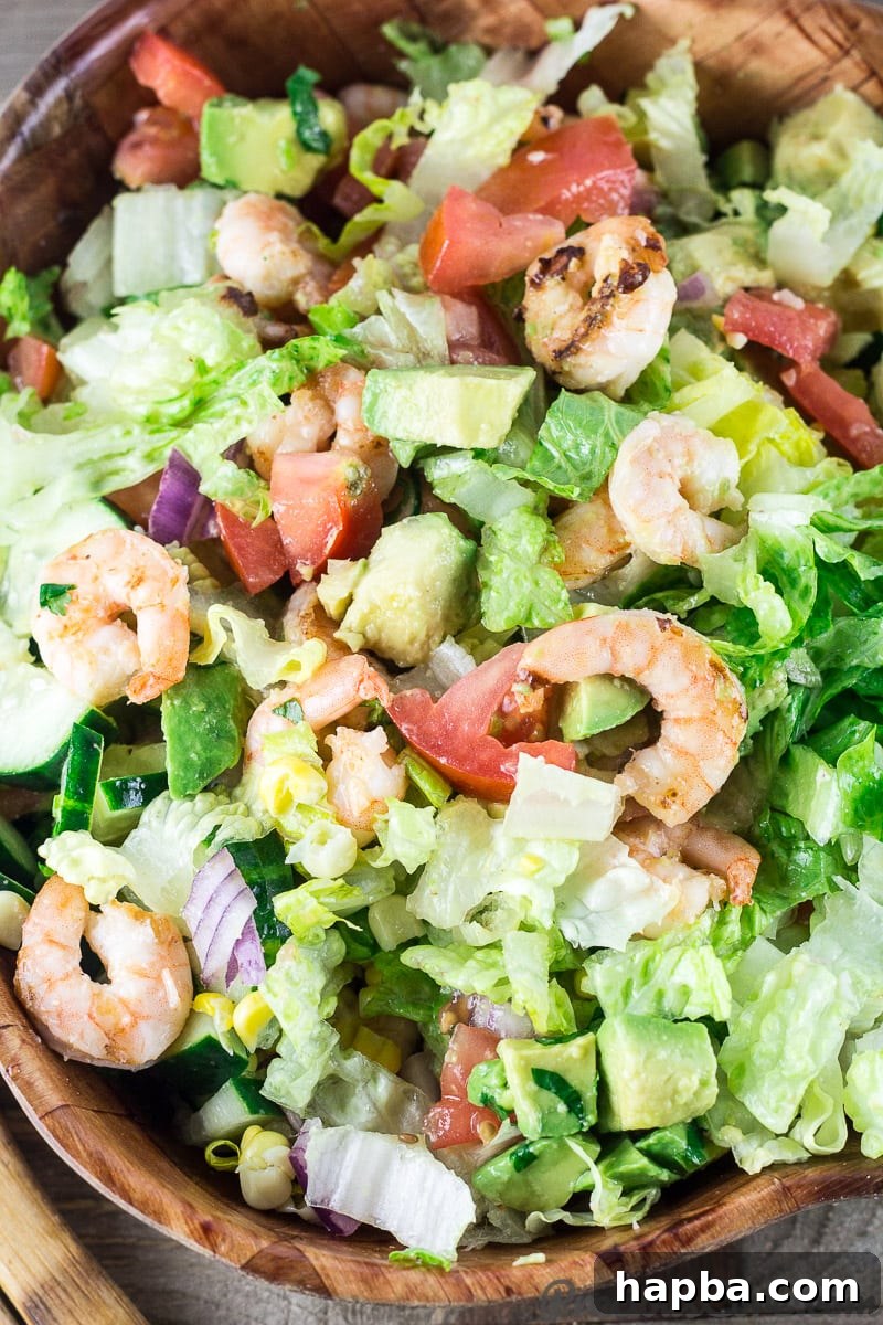 Vibrant Shrimp Avocado Medley 5 Delicious Shrimp Avocado Tomato Salad, ready to be enjoyed.