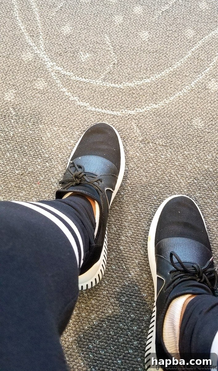 My sneakers waiting to travel at Minneapolis Saint Paul International Airport, symbolizing the start of a food blogging adventure