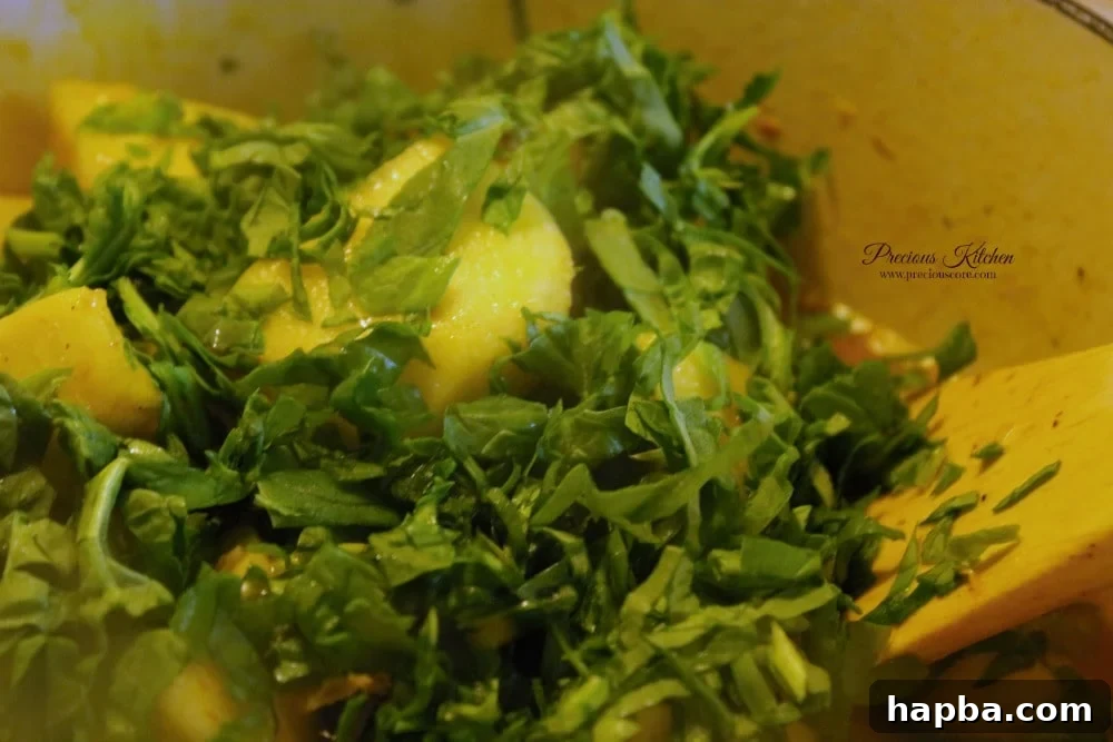 Yam porridge cooking, ready for greens