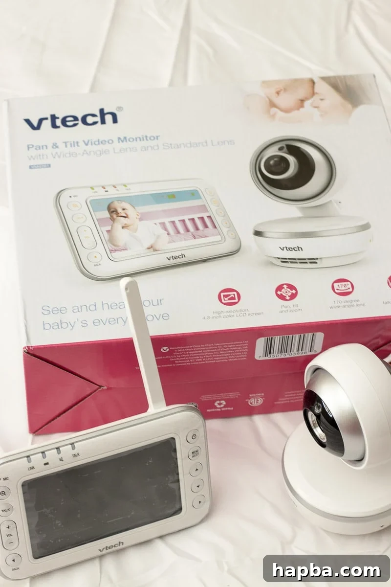 preparing for a new baby checklist - mom holding baby monitor