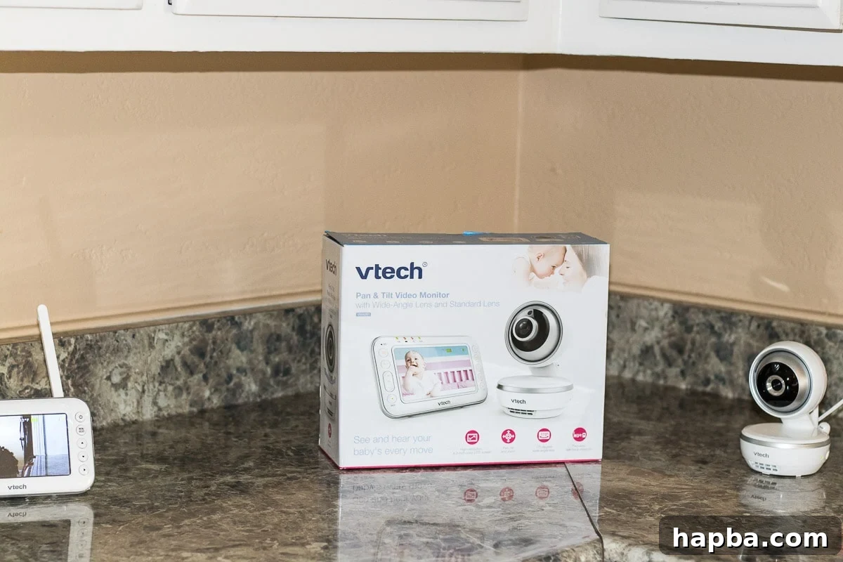 preparing for a baby checklist - mom setting up baby monitor