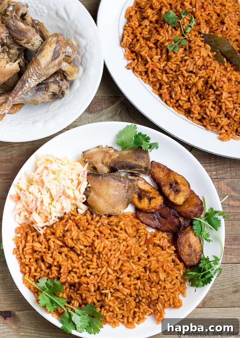 Nigerian Jollof Rice served beautifully with crispy fried chicken.