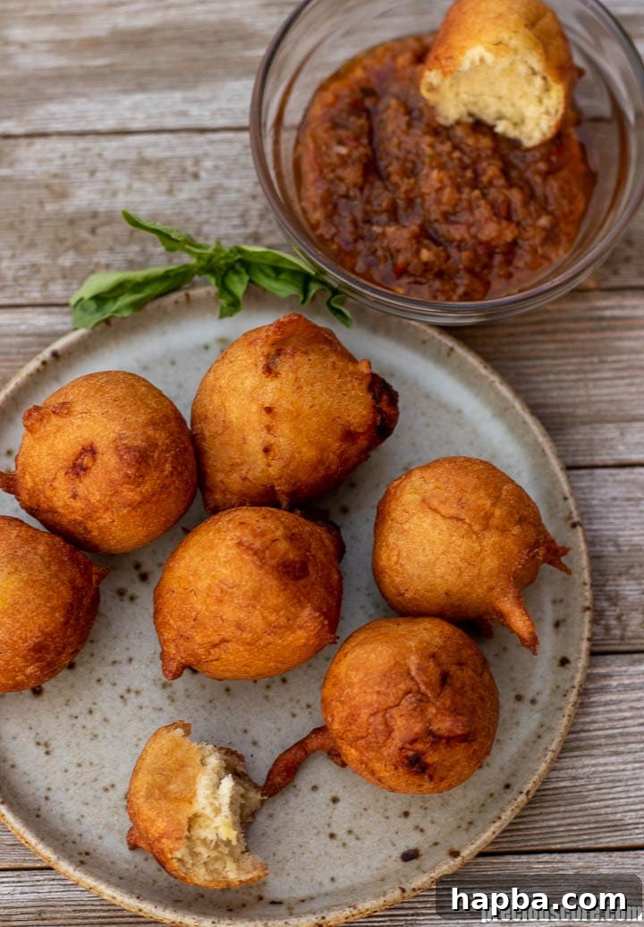 Golden Banana Bites 11 Banana Fritters served with African pepper sauce.
