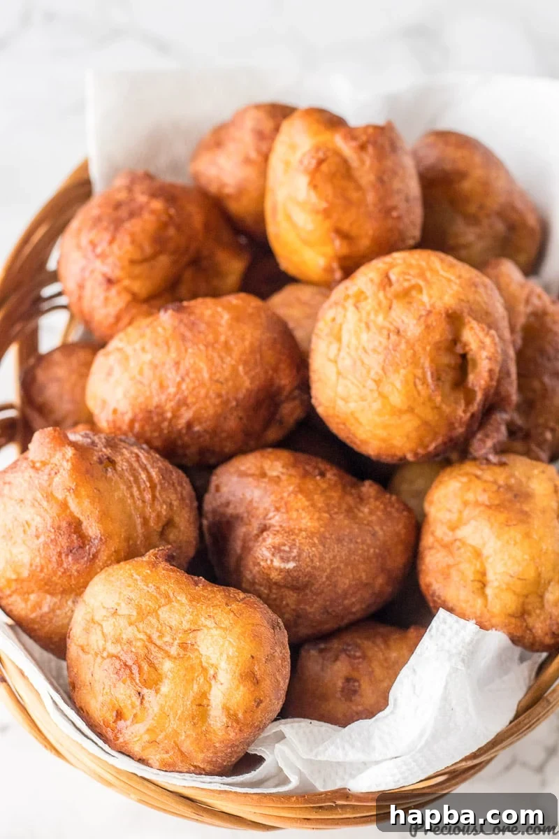 Golden Banana Bites 3 Fritters in a basket.
