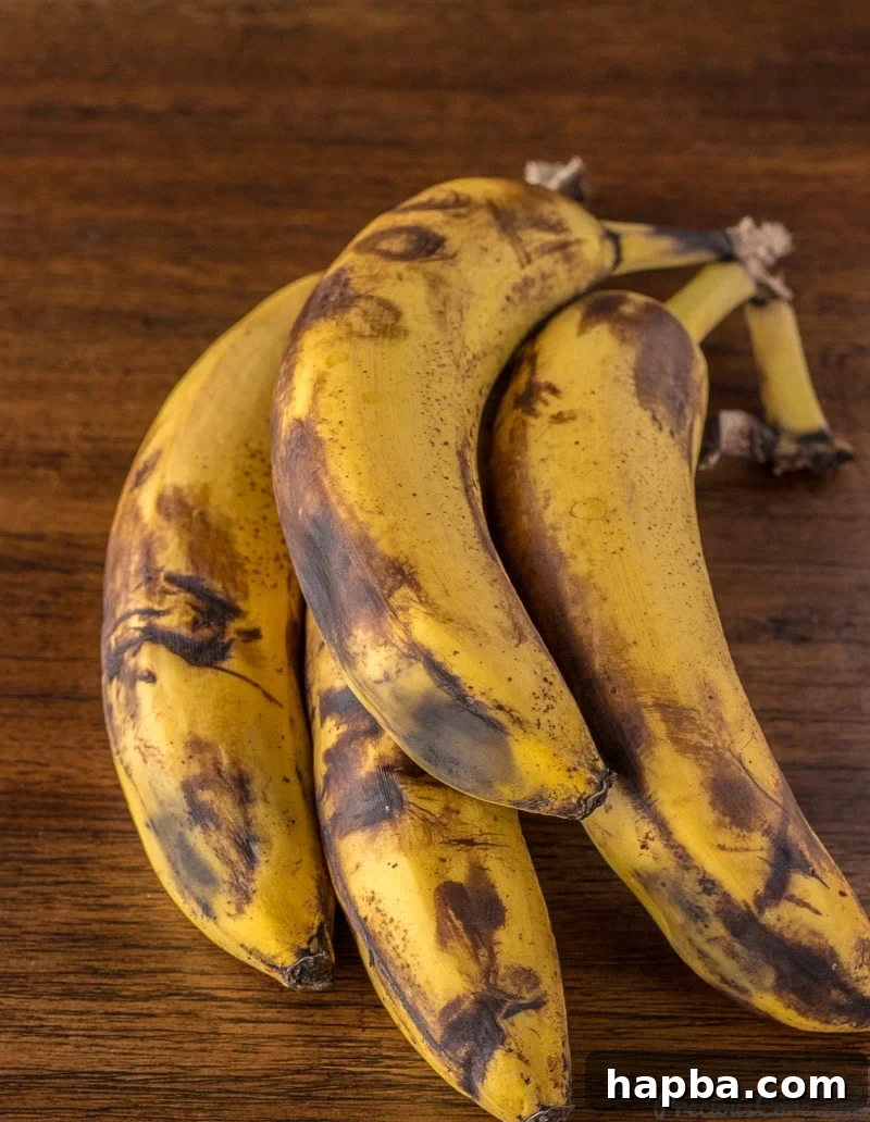 Golden Banana Bites 4 Overripe bananas with black spots.