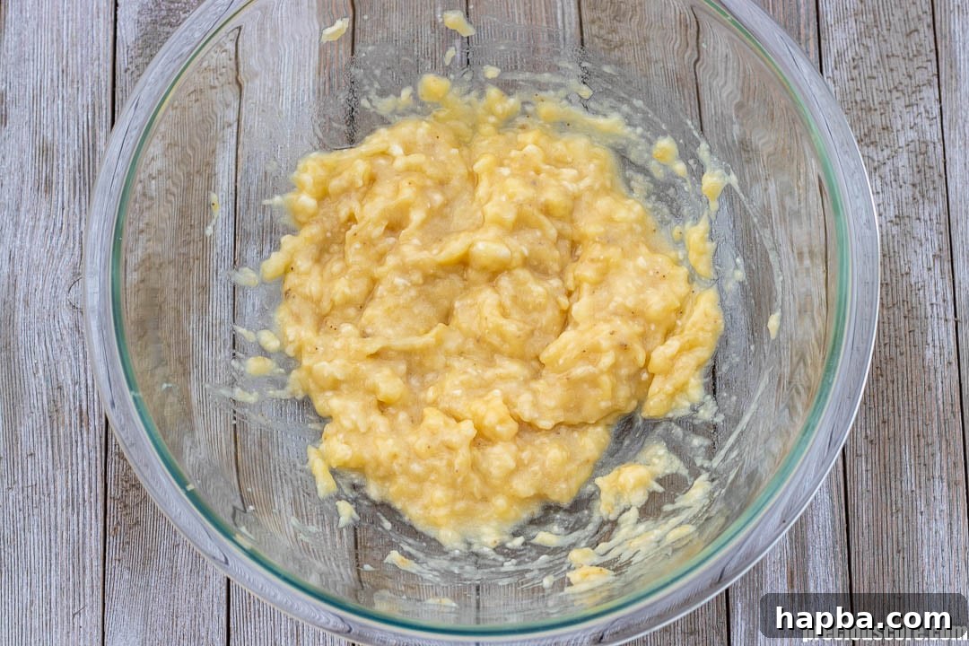 Golden Banana Bites 6 Mashed bananas in a mixing bowl.