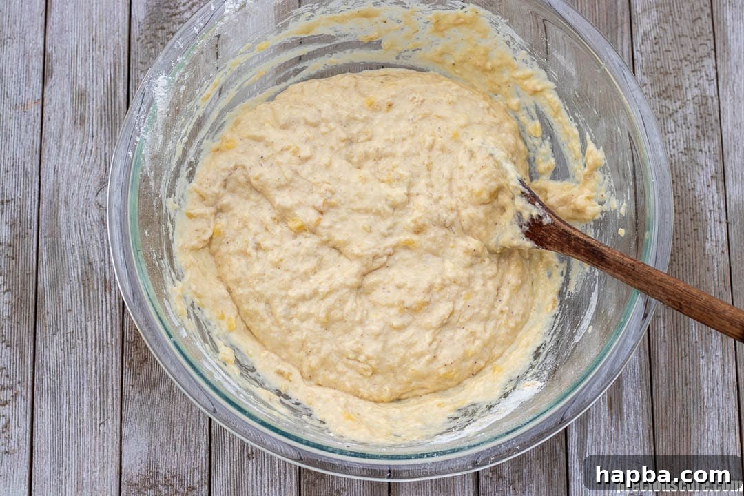 Golden Banana Bites 7 Batter in a mixing bowl.