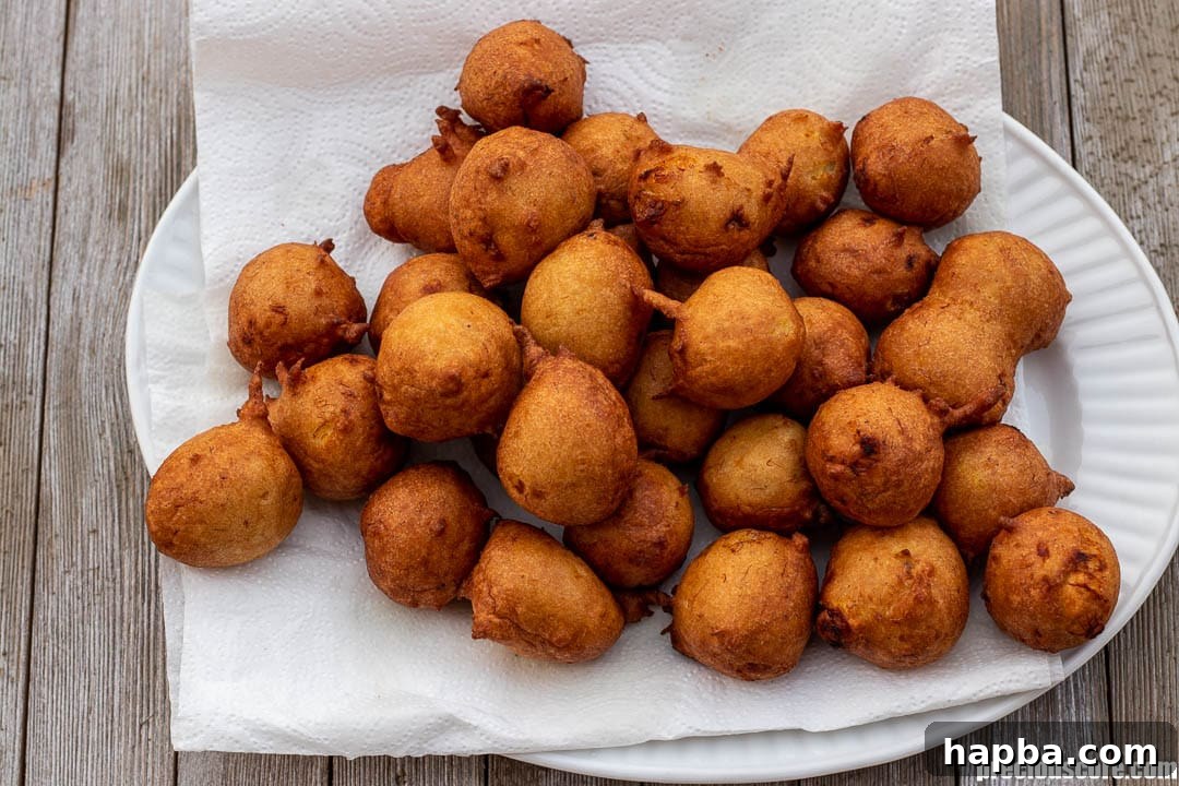 Golden Banana Bites 9 Fritters on paper towels.