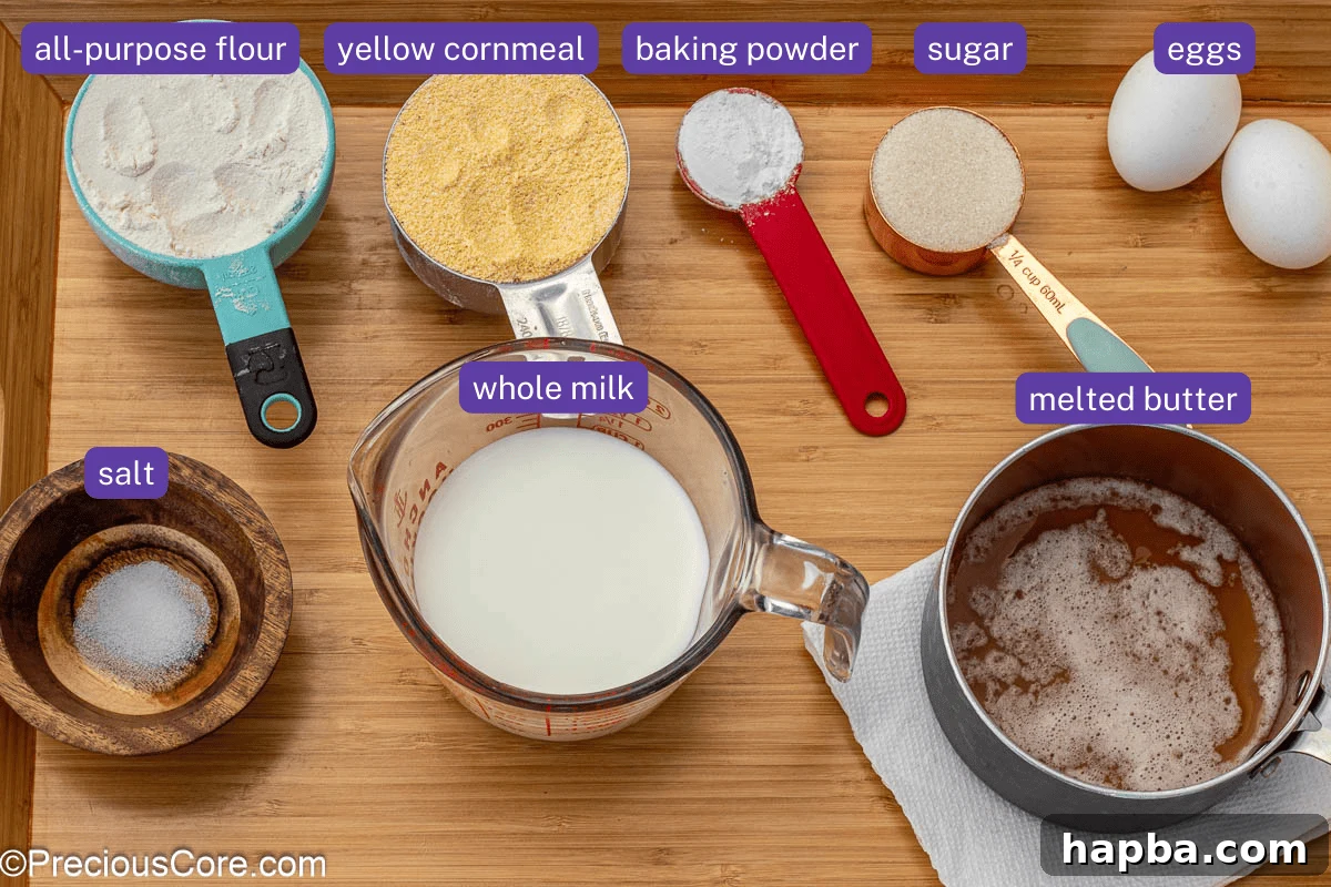 Moist Cornbread Without Buttermilk 6 All essential ingredients for making cornbread, neatly labeled and displayed on a rustic wooden surface.