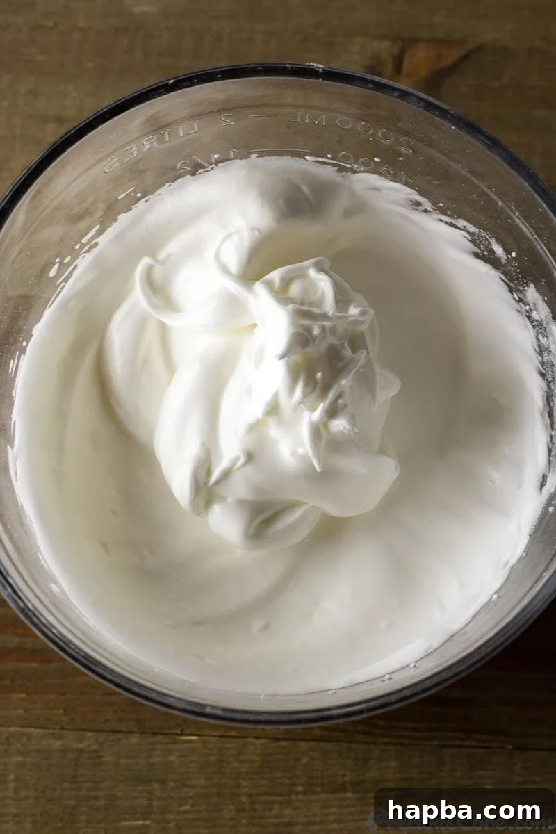 Golden Vanilla Dream 4 Glass bowl of whipped egg whites.