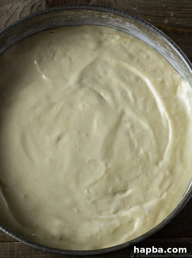 Golden Vanilla Dream 7 Vanilla Sponge Cake batter in a cake pan.