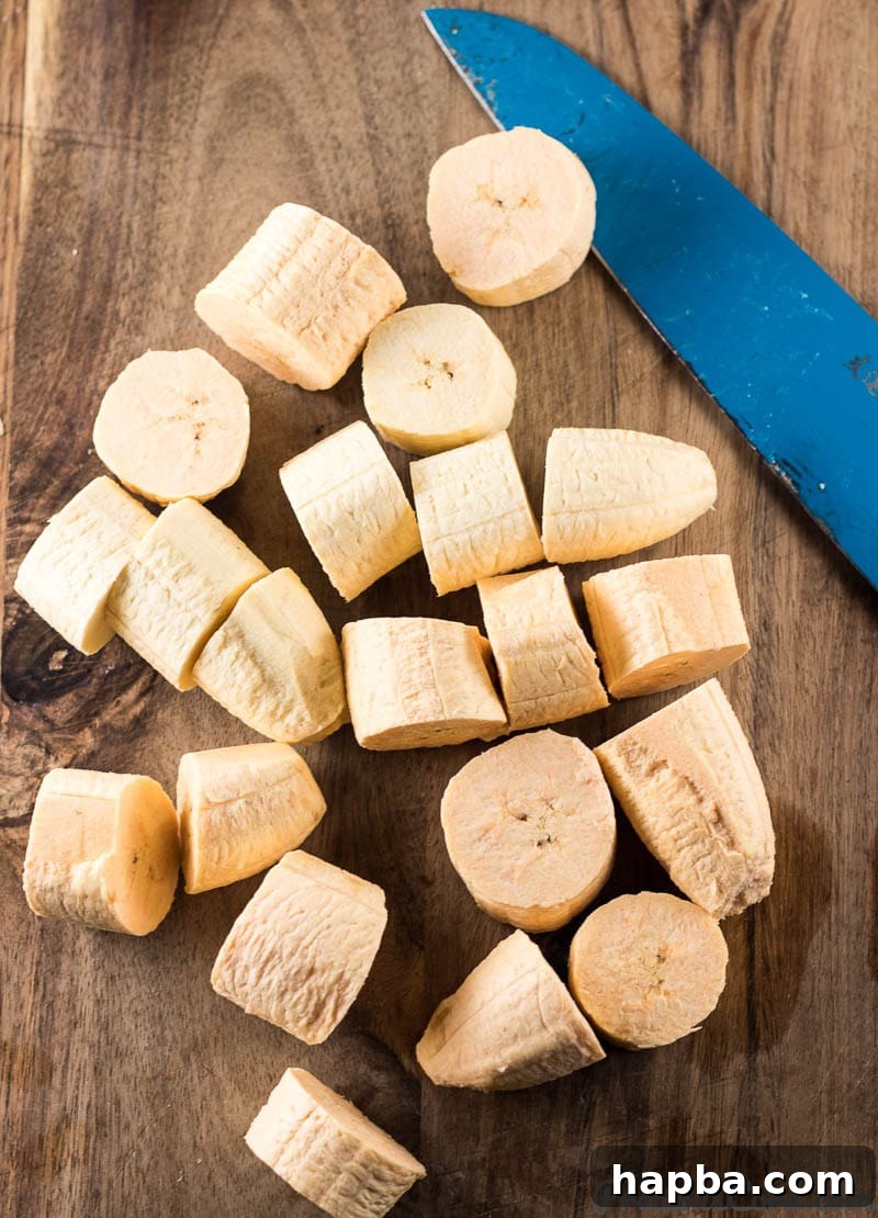 Crispy Tostones: Mastering the Twice-Fried Plantain 5 Knife with sliced plantains.