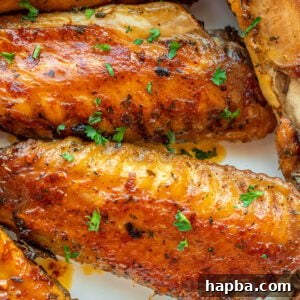 Oven Baked Turkey Wings in a white serving bowl.