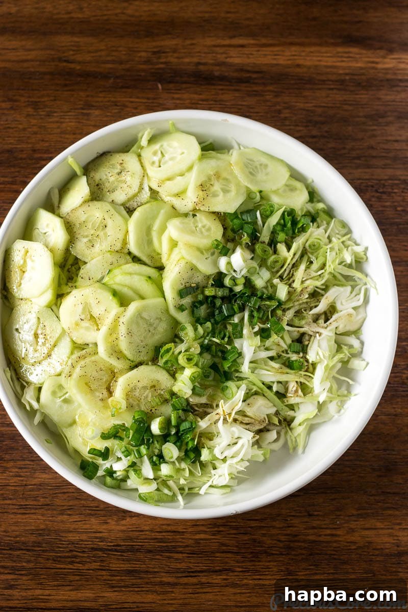 Refreshing Cabbage Slaw 2 Bright and crunchy Cabbage Salad in a pristine white bowl, ready to be enjoyed.