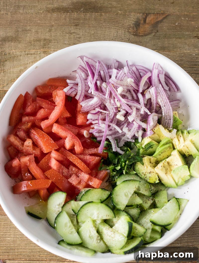 Simple Kenyan Kachumbari salad served in a bowl, showcasing its fresh ingredients and dressing.