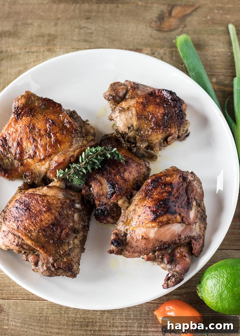Island Fire Jerk Chicken 2 Delicious oven-baked Jamaican Jerk Chicken Thighs on a baking sheet