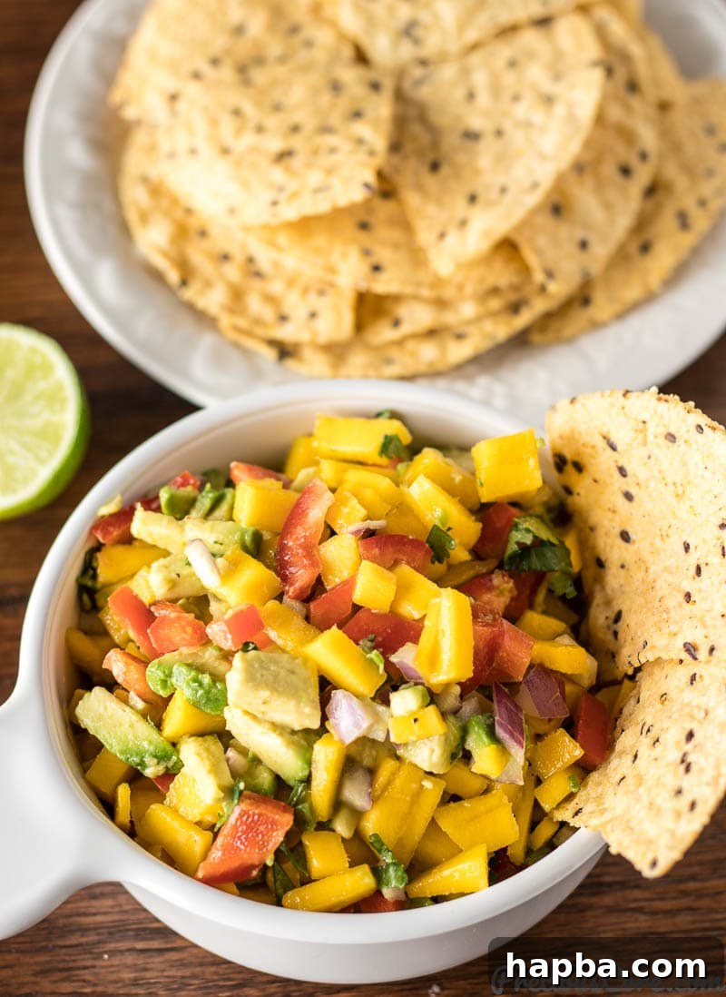 Homemade mango avocado salsa served with crispy tortilla chips.