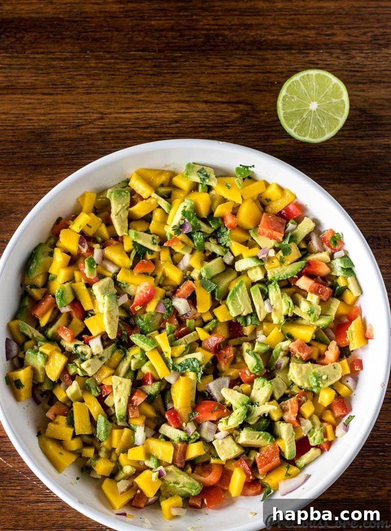 Mango Avocado Salsa in a large white bowl, ready to serve.