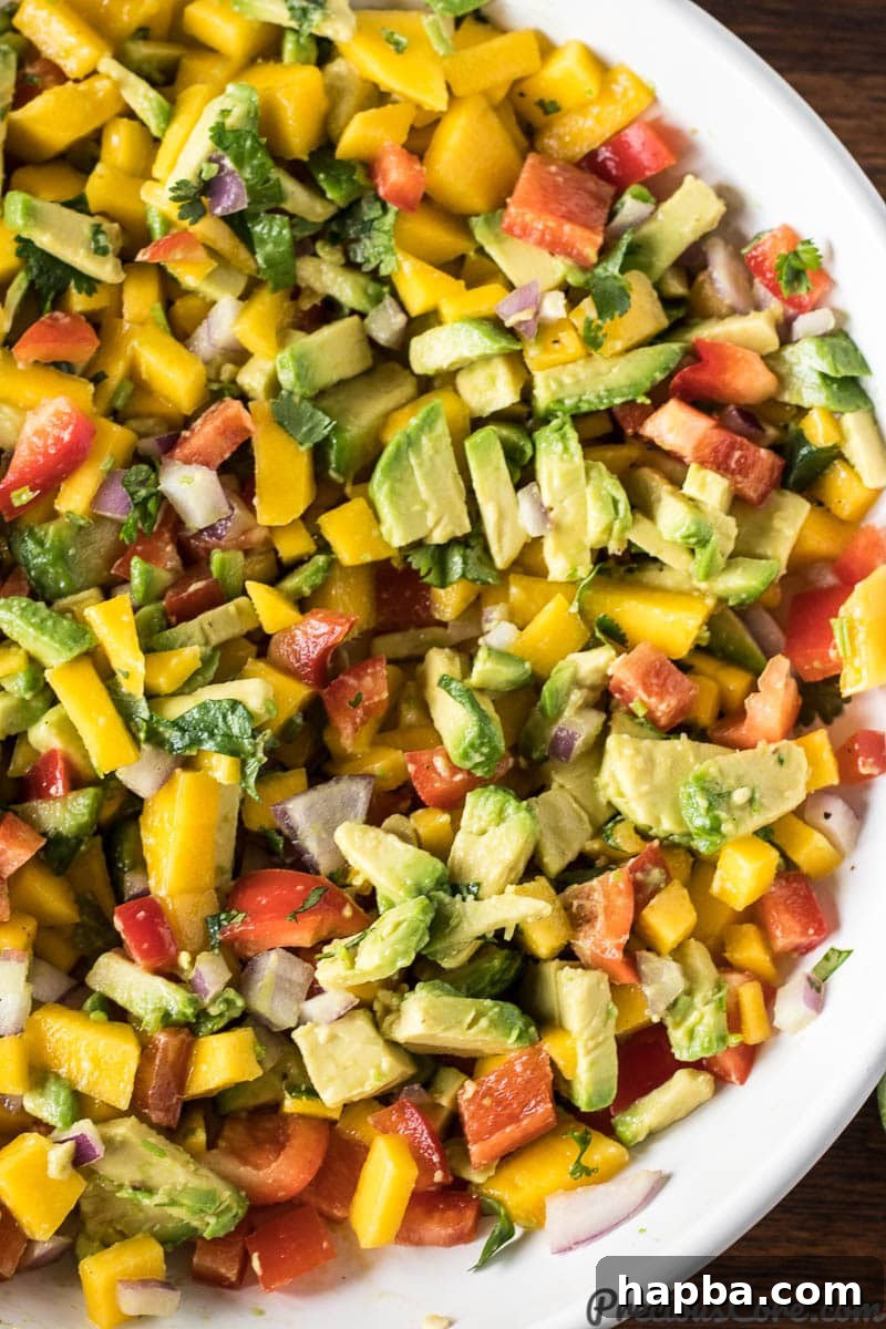 Mixed Mango Avocado Salsa, perfectly combined in a bowl.
