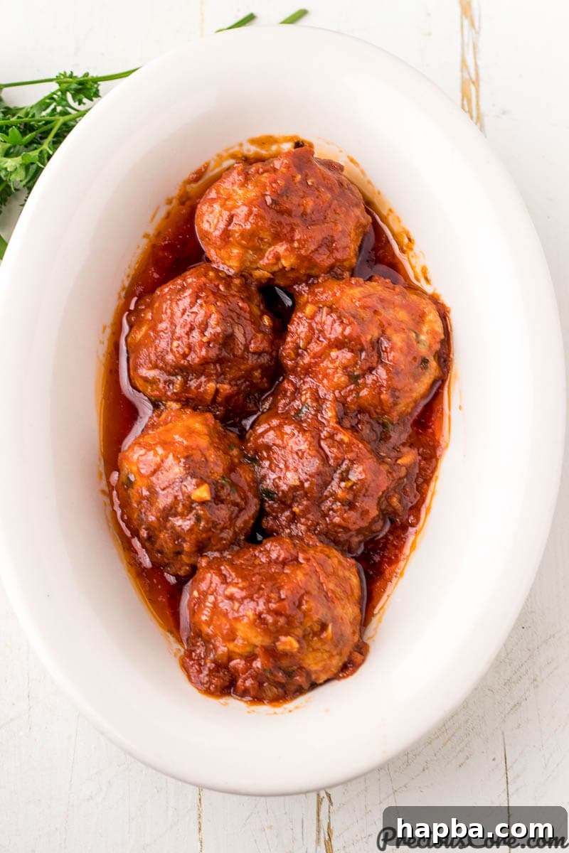 Bowl of baked chicken meatballs, perfect for spaghetti.