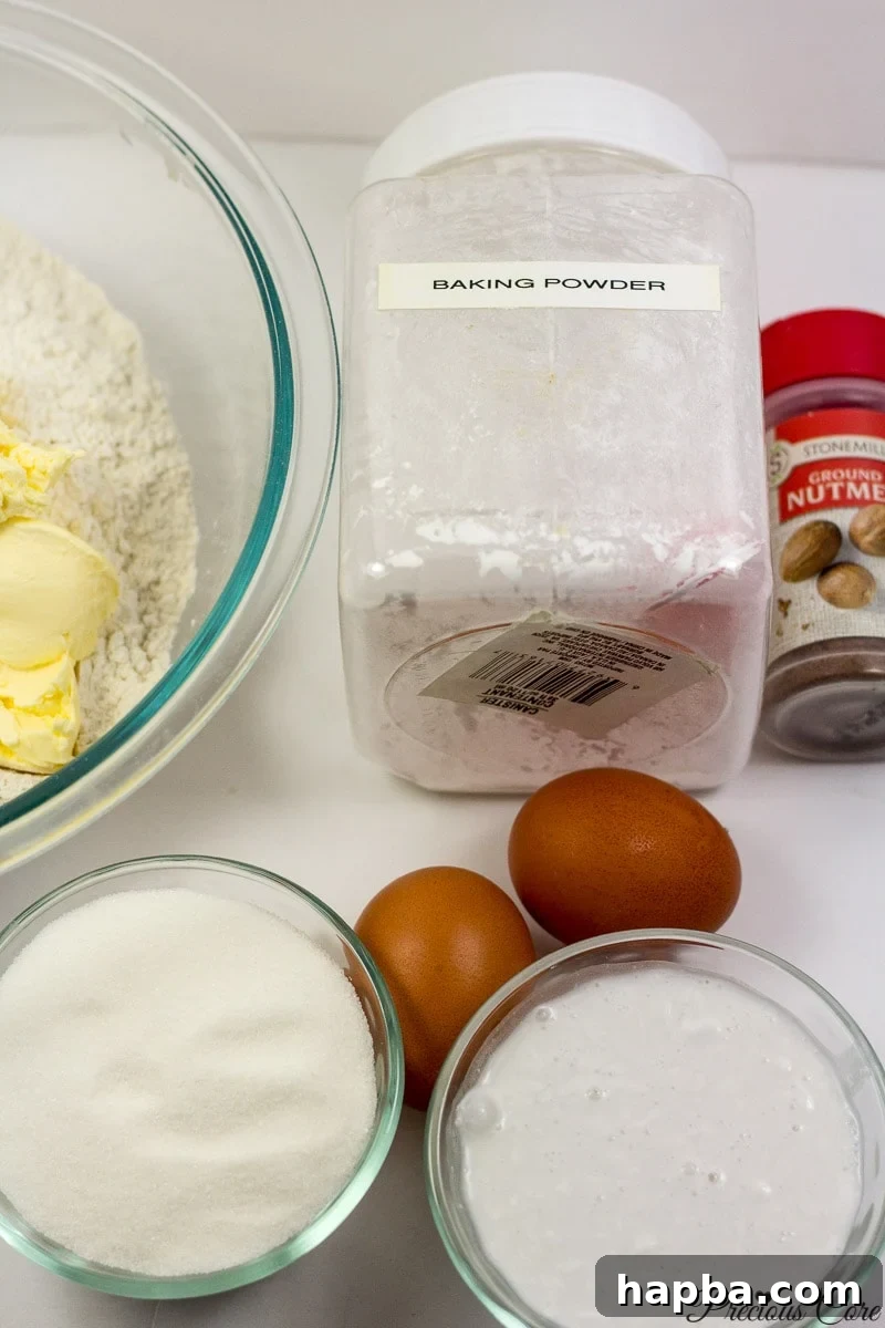 Assorted ingredients for making Cameroonian doughnuts laid out on a surface.
