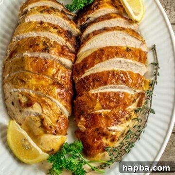 2 sliced baked turkey breasts on serving platter