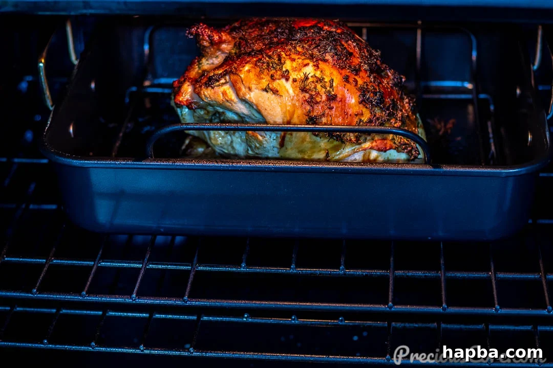Double turkey breast baking in oven