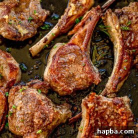 Pan seared lamb chops in a cast iron skillet.