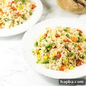 White bowls of coconut fried rice.