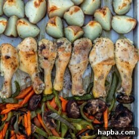 Roasted chicken, potatoes and veggies on a sheet pan