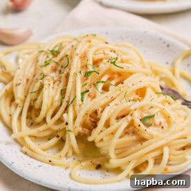 Lemon Garlic Butter Pasta on a speckled plate.