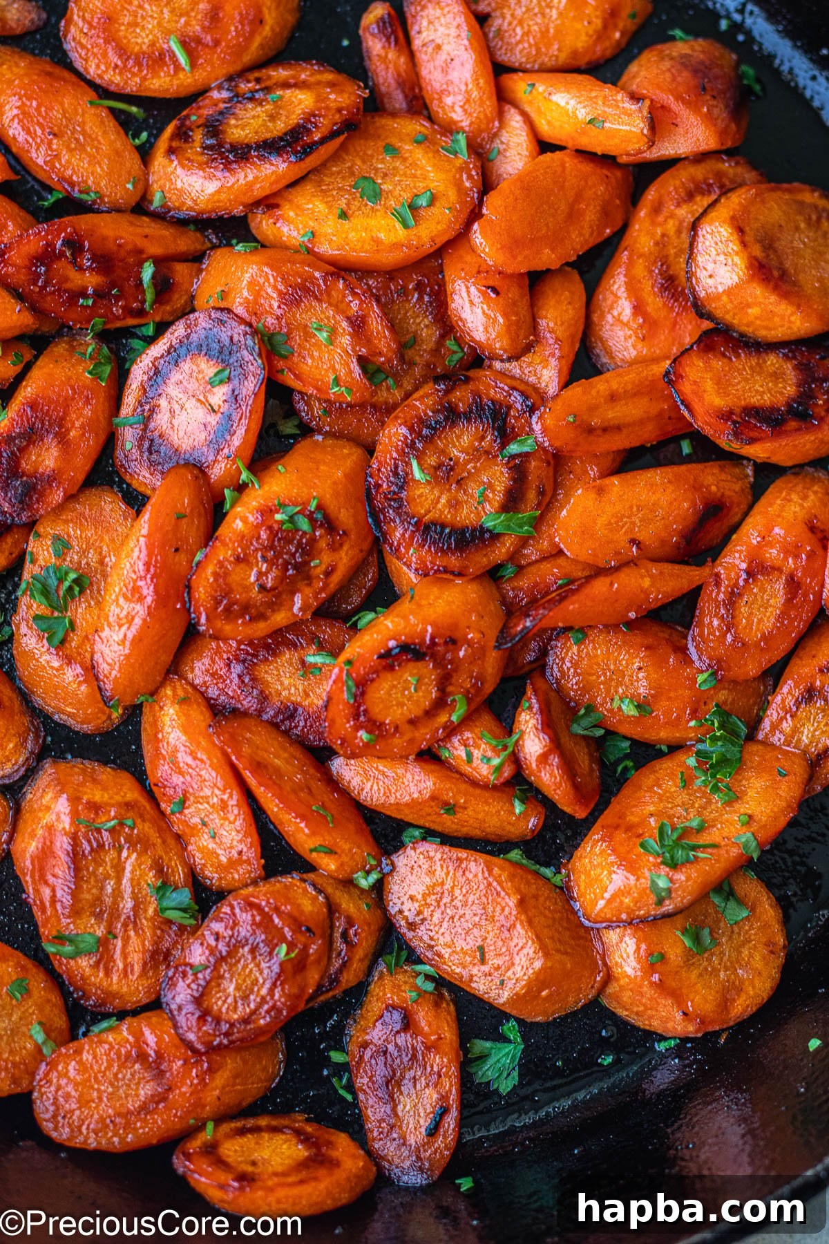 Fried Carrots in a cast iron skillet.