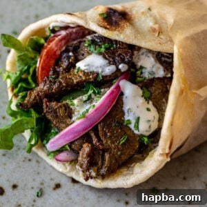 Close up image of beef shawarma wrap.